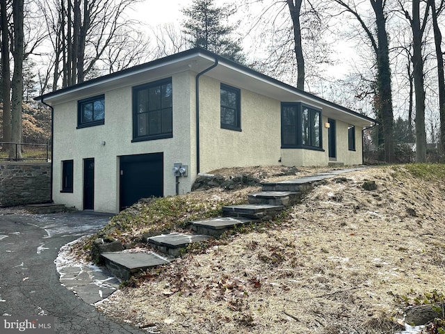 view of property exterior featuring a garage