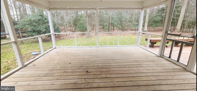 unfurnished sunroom featuring a wealth of natural light