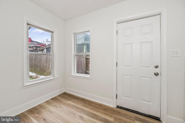 interior space with light hardwood / wood-style flooring and a wealth of natural light