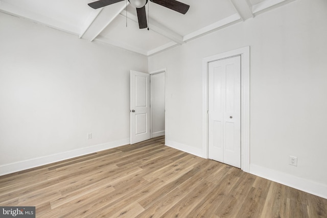 unfurnished bedroom featuring beamed ceiling, wood-type flooring, ceiling fan, and coffered ceiling