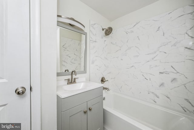 bathroom featuring vanity and shower / tub combination