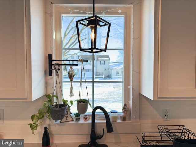 interior details featuring white cabinets