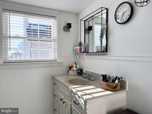 bathroom with plenty of natural light and vanity