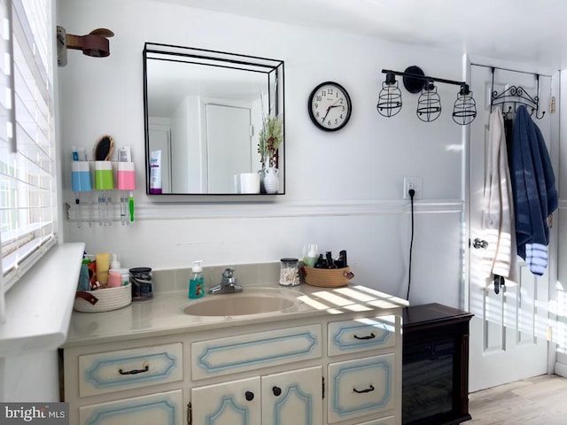 bathroom with vanity and wood-type flooring