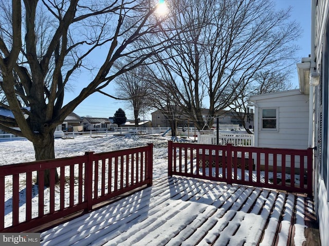 view of snow covered deck