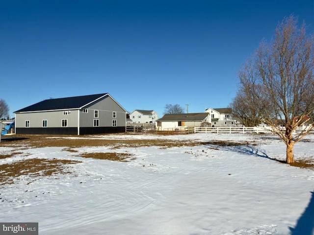 view of yard layered in snow