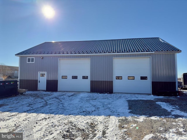 view of snow covered garage