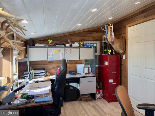 office space featuring light hardwood / wood-style flooring, vaulted ceiling, wooden walls, and wood ceiling