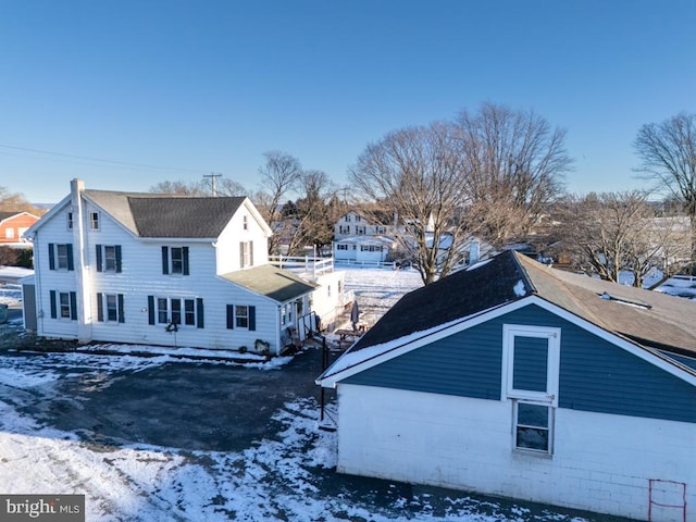 view of snow covered property