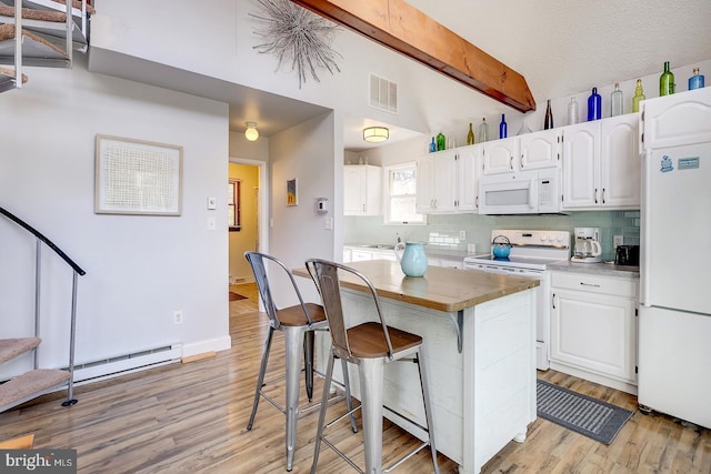 kitchen featuring beam ceiling, decorative backsplash, white cabinets, and white appliances