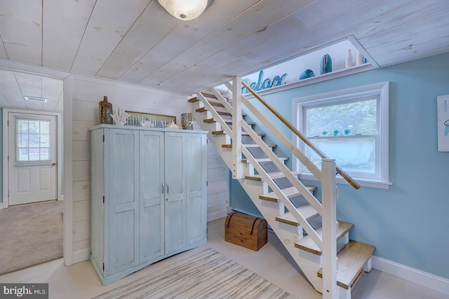 staircase with carpet and wood ceiling