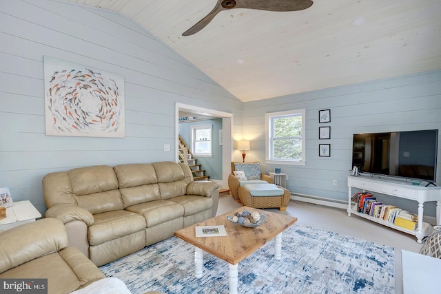 living room featuring a baseboard radiator, vaulted ceiling, and wood walls