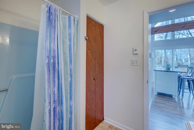 bathroom featuring a shower with curtain