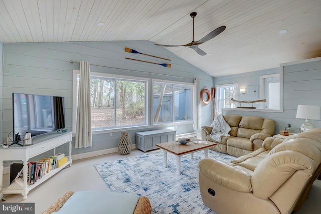 living room featuring wooden walls, vaulted ceiling, ceiling fan, concrete flooring, and wood ceiling