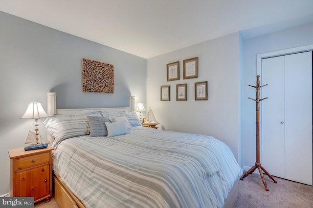 carpeted bedroom with a closet