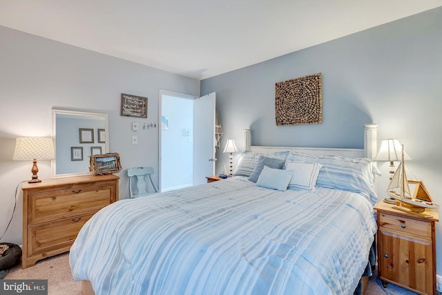 bedroom featuring light carpet