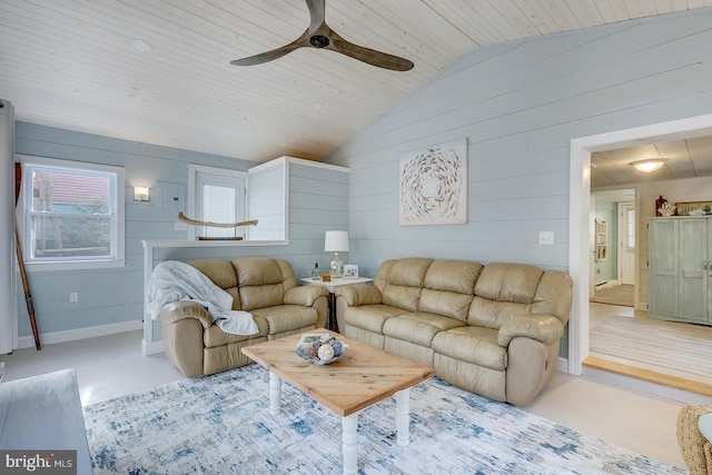 living room featuring wooden ceiling, vaulted ceiling, ceiling fan, and wooden walls