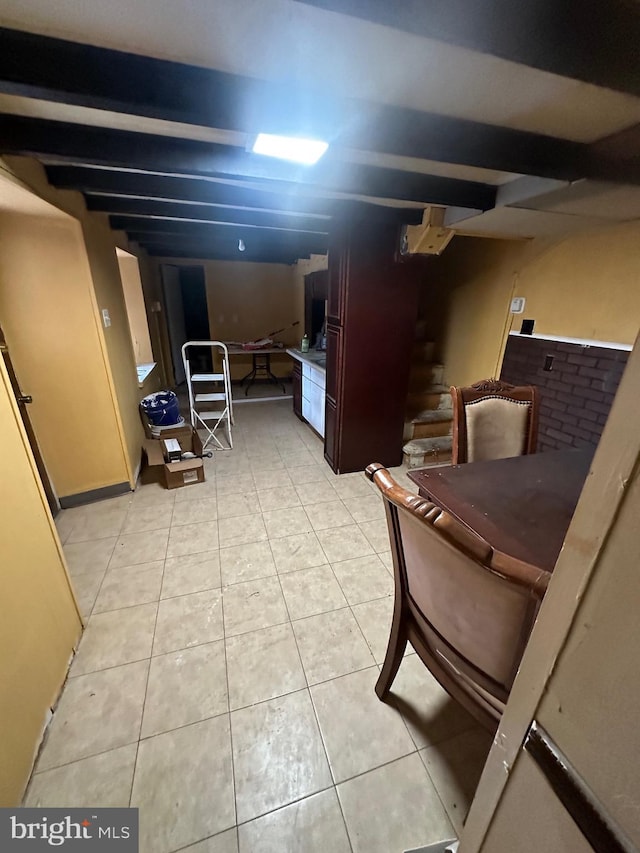 basement featuring light tile patterned floors