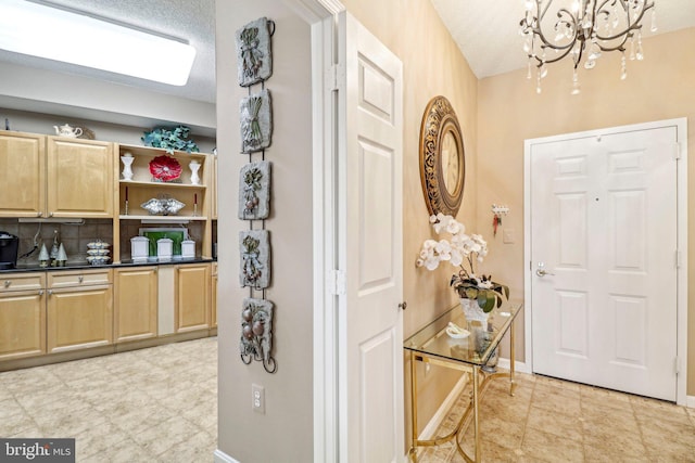 interior space featuring a notable chandelier and a textured ceiling