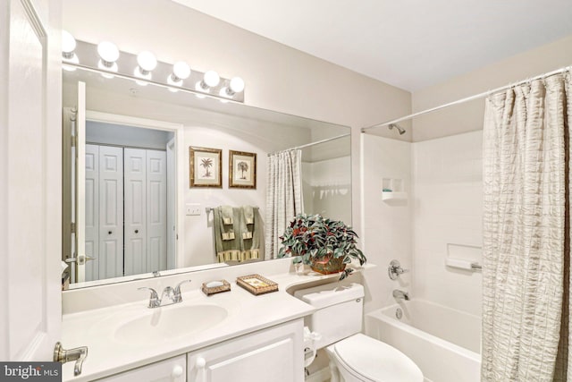 full bathroom featuring shower / tub combo, vanity, and toilet