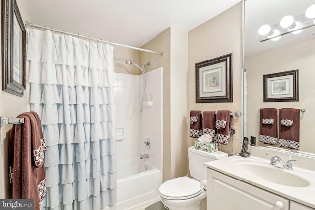 full bathroom with shower / bath combination with curtain, toilet, and vanity