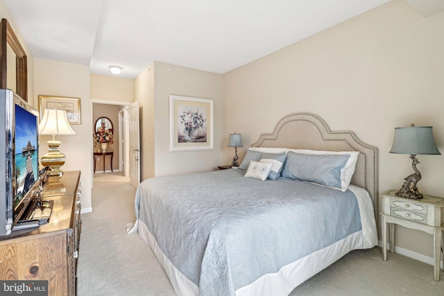 bedroom with light colored carpet