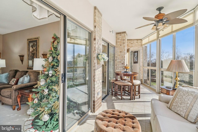 sunroom / solarium with ceiling fan