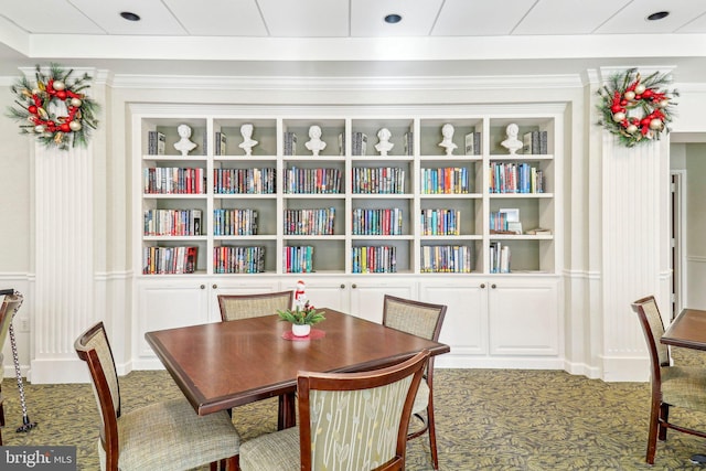 dining room featuring carpet flooring and built in features