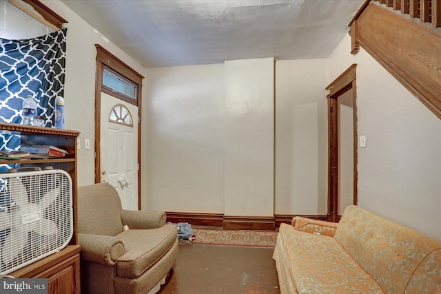 living area with concrete floors