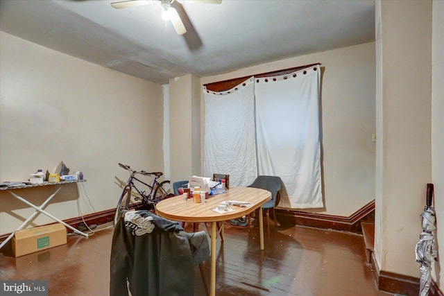 dining room with ceiling fan and wood-type flooring