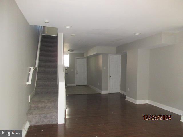 interior space with dark hardwood / wood-style floors