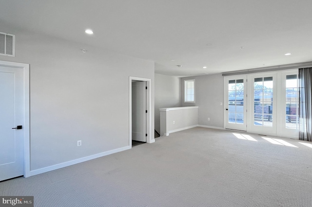 empty room featuring light colored carpet