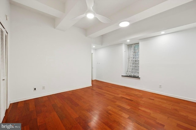 basement featuring hardwood / wood-style flooring and ceiling fan