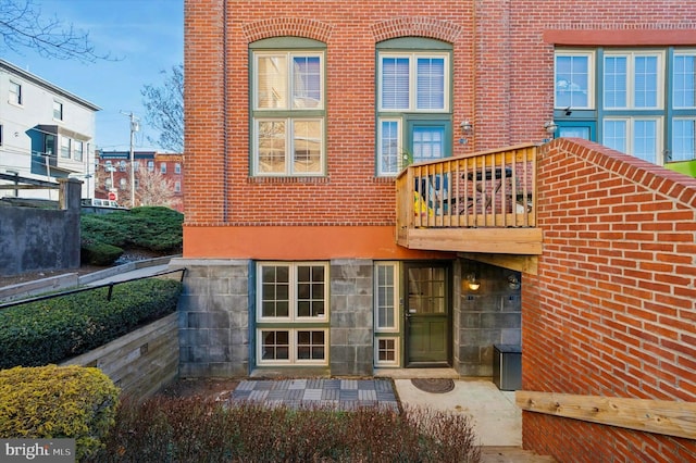 rear view of property with a balcony