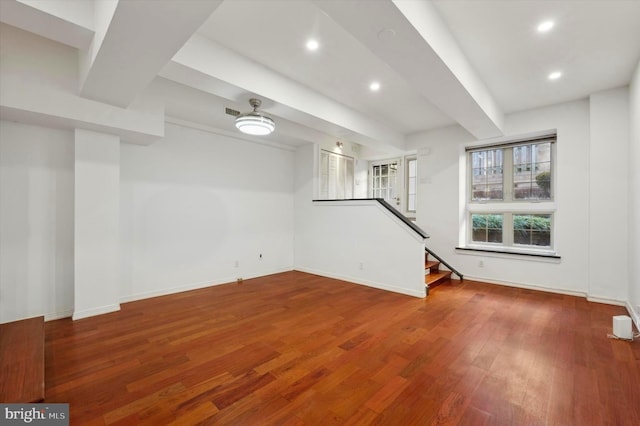 unfurnished living room featuring hardwood / wood-style flooring