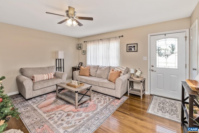 living room with hardwood / wood-style flooring, ceiling fan, and a wealth of natural light