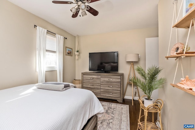 bedroom with ceiling fan and wood-type flooring