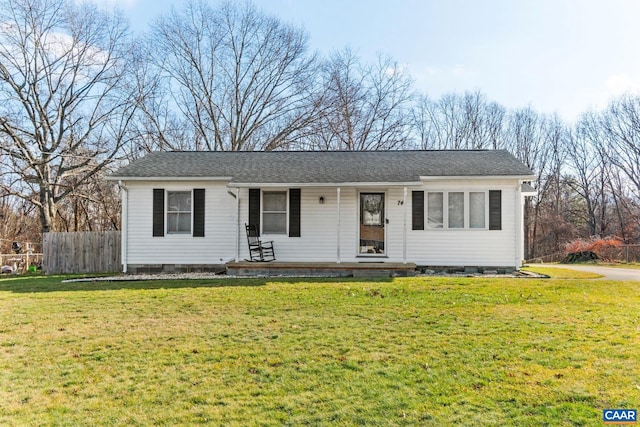 ranch-style home featuring a porch and a front lawn