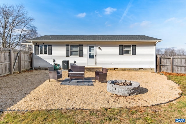 back of property featuring central AC, a patio, and an outdoor fire pit