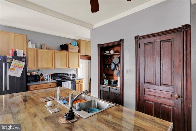 kitchen featuring sink, wood counters, light brown cabinetry, black appliances, and ornamental molding