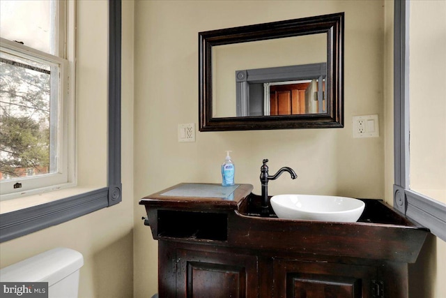 bathroom featuring vanity and toilet