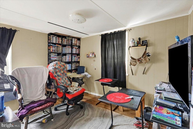 office area with hardwood / wood-style flooring and crown molding