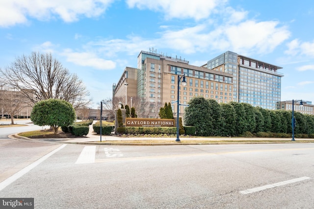 view of building exterior featuring uncovered parking