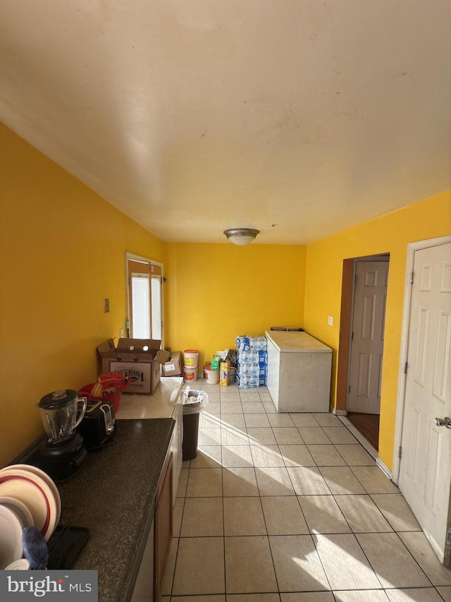 interior space featuring light tile patterned floors