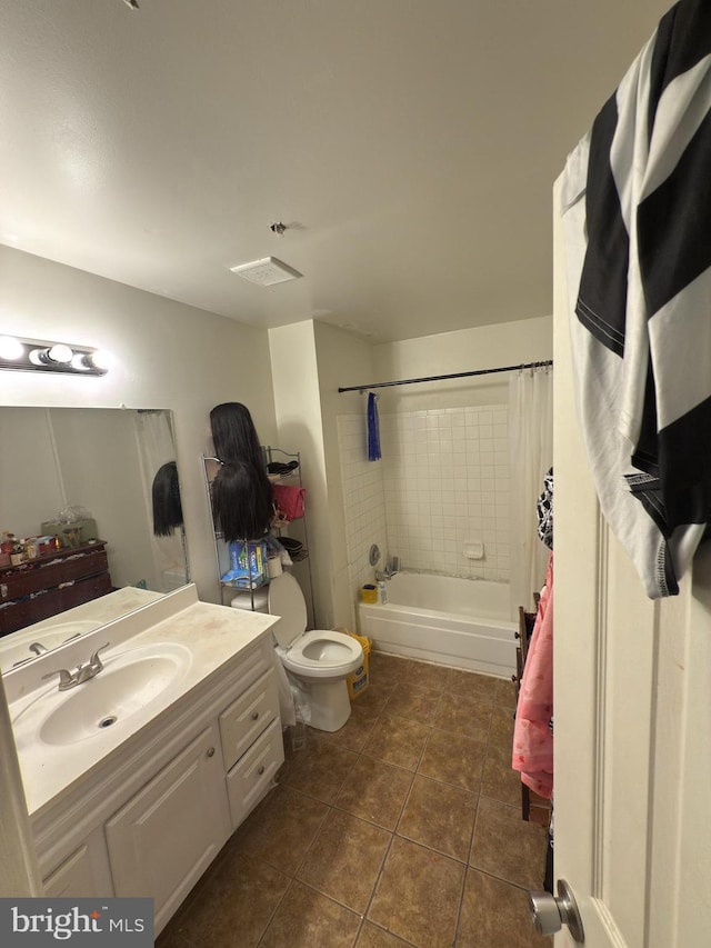 full bathroom with tile patterned floors, vanity, toilet, and shower / tub combo