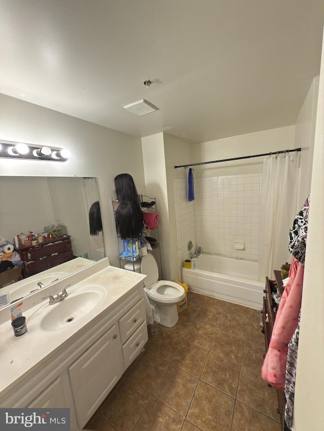 full bathroom featuring shower / bath combo, vanity, toilet, and tile patterned floors