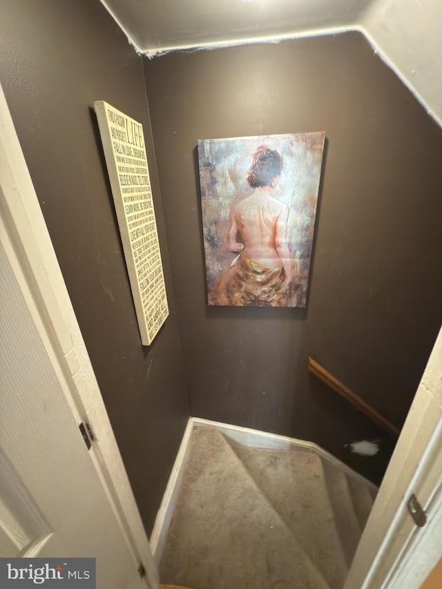 stairway featuring vaulted ceiling