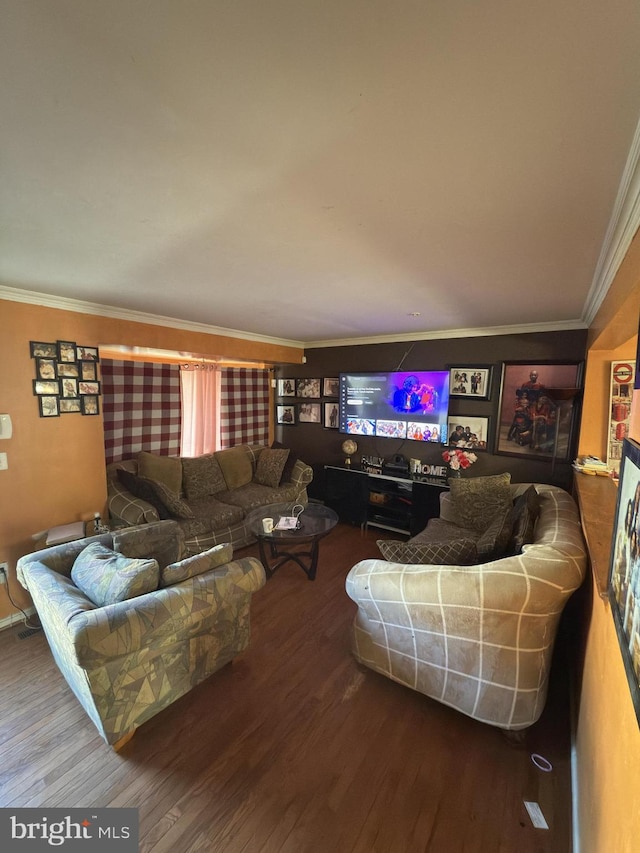 living room featuring hardwood / wood-style floors and crown molding