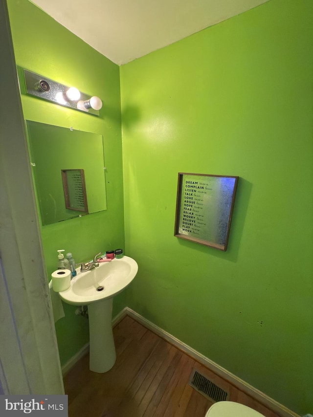 bathroom featuring wood-type flooring