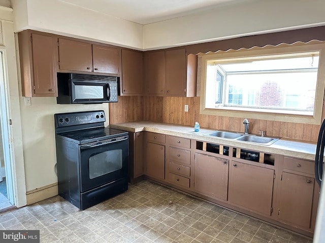 kitchen with sink and black appliances